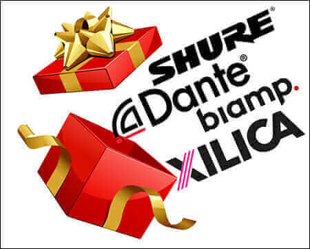 Open gift box with logos: Shure, Dante, Biamp, Xilica; red wrapping, gold ribbon, holiday season brands.