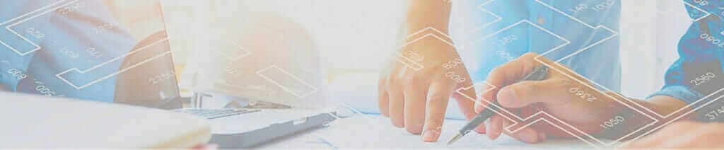 Collaborative team planning with blueprints and laptop, showcasing effective work process and design strategy.