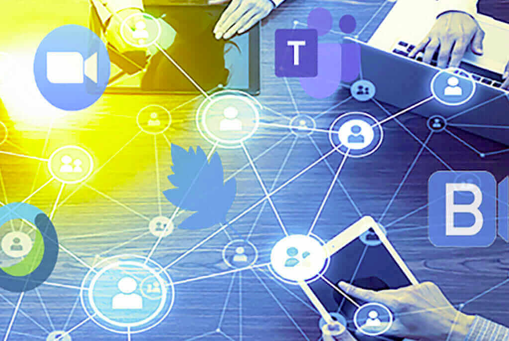 Unified communications network with digital devices and social media icons on a desk, enhancing collaboration and connectivity.