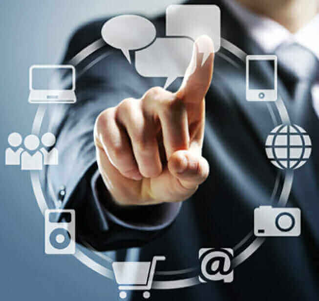 Businessman interacting with digital icons representing technology, communication, and media on a virtual interface.