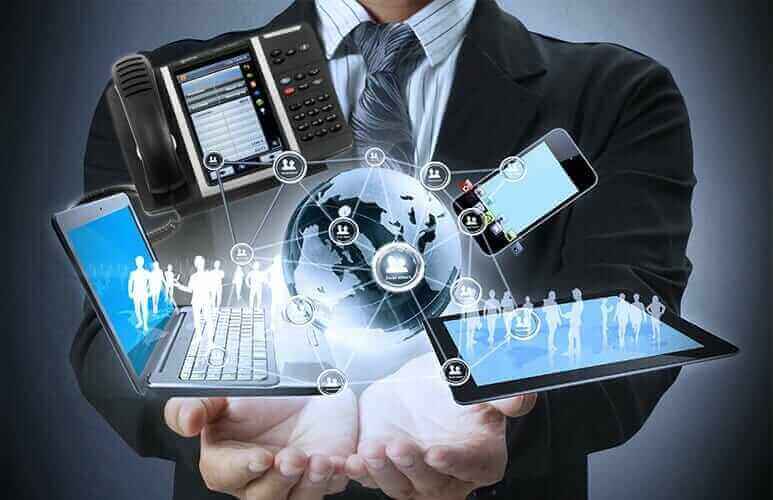 Innovative technology solutions with Captus Systems; businessman holding digital devices and globe network concept.